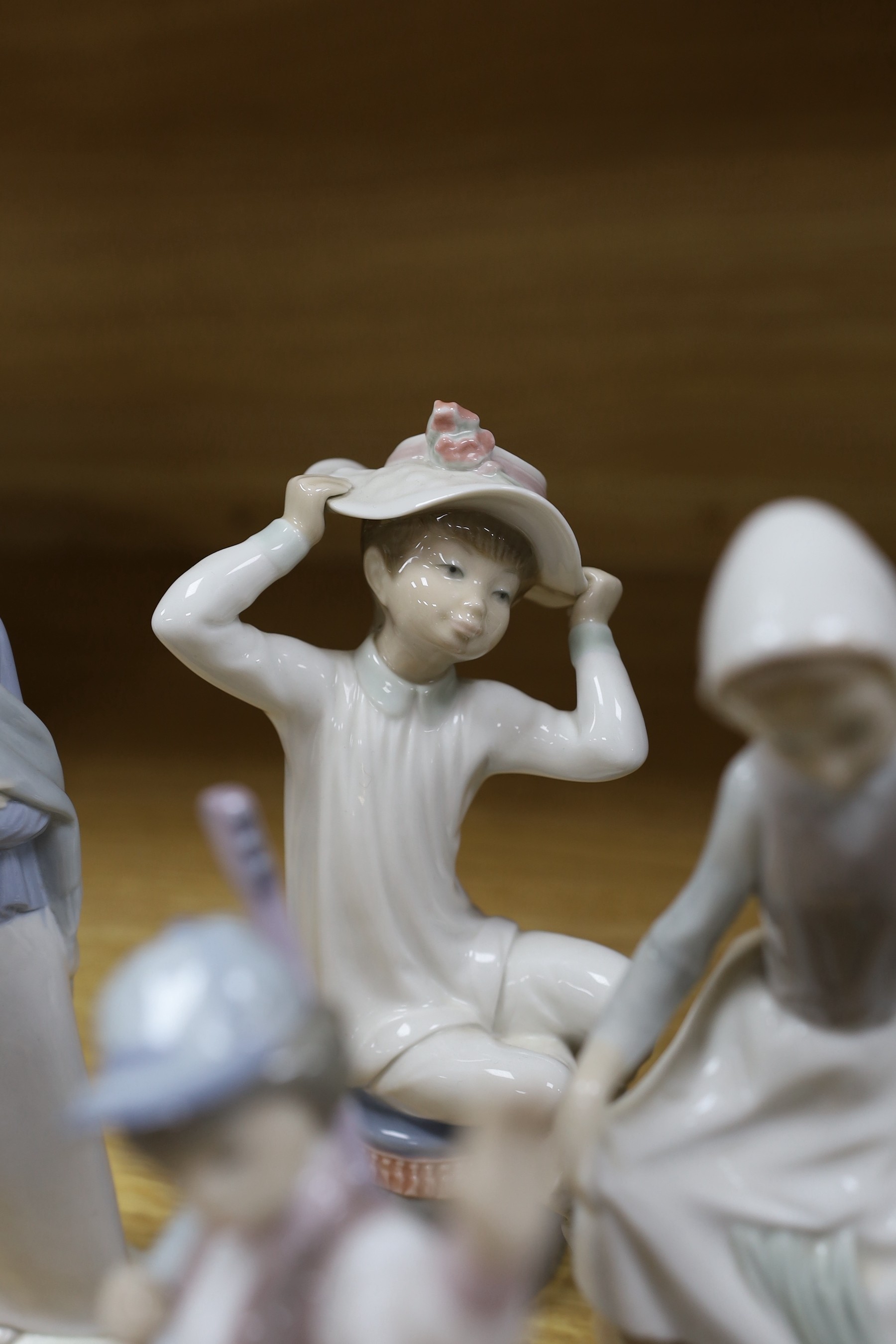A selection of eight Lladro figures, tallest 33cm